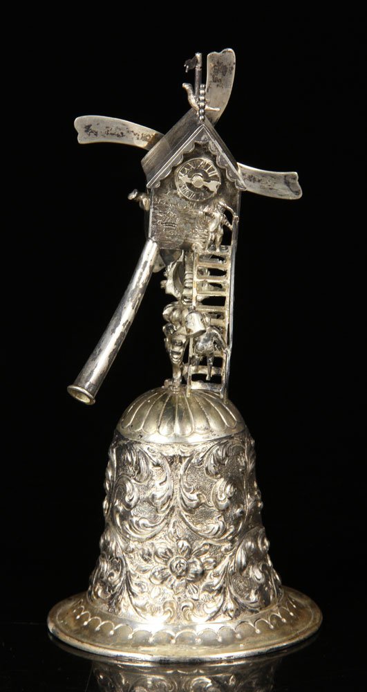 Dutch Silver Windmill Bell: Dutch articulated windmill bell, silver, with mouthpiece to create spinning motion, 7 1/2" h, approx. 6.9 troy oz total weight. Provenance: from a New Hampshire estate.