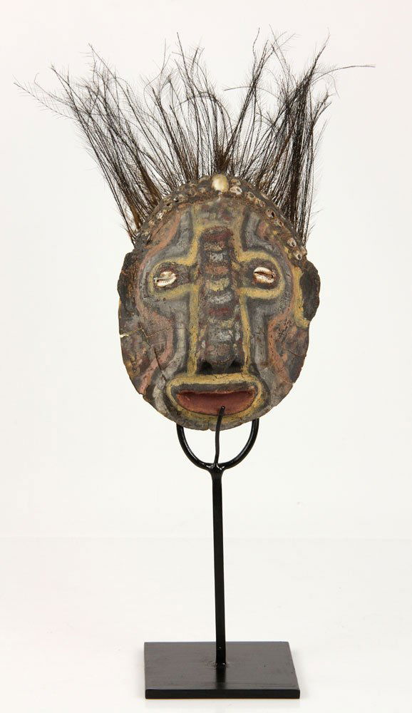 Turtle Shell Mask: Papua New Guinean mask, turtle shell, painted, with cowrie shells and feathers, 5 1/2" h x 12" w. Provenance: acquired in New Zealand in the 1970's, from a California estate.