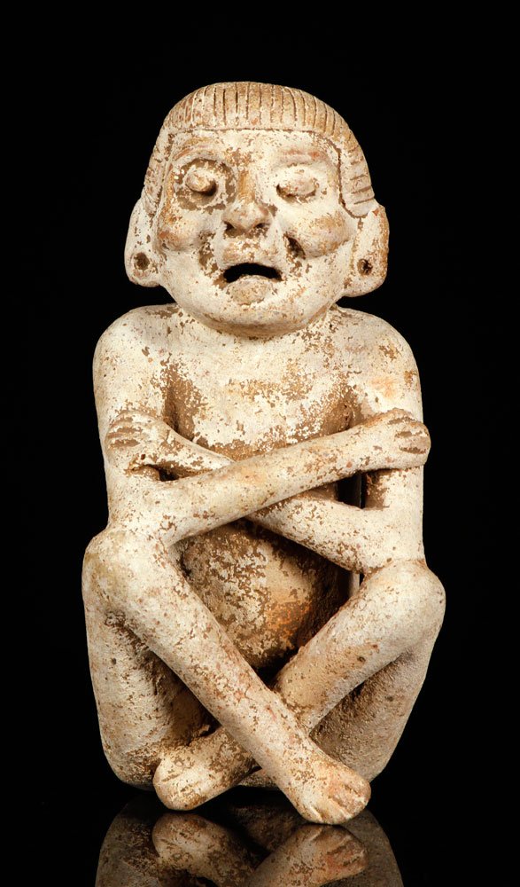 Mayan Shaman Sculpture: Mayan Sculpture of a seated shaman, Guatemala, 9" h x 4 1/2" w. Provenance: from a California estate.