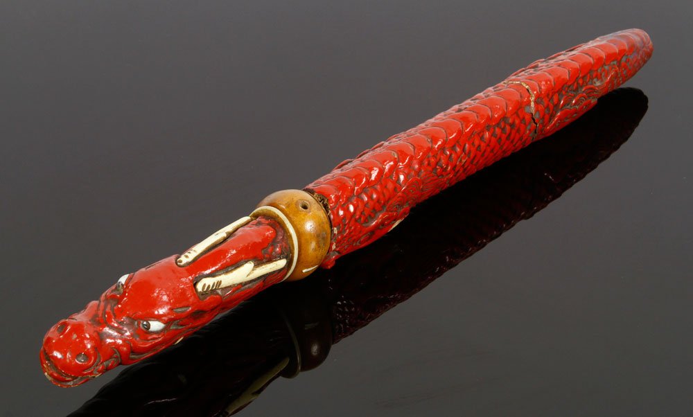 Red Dragon Aikuchi: Japanese aikuchi, custom red lacquer hilt and scabbard with bone accents, dragon design; 10" l (blade), 15 1/2" (overall). Provenance: From the unreserved Vincent J. Vabri Edged Weapon Collection.