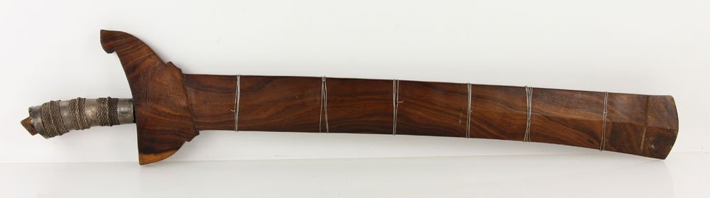 Moro Kris: Moro kris, long wavy blade, scabbard wrapped with silver wire; 21" l (blade), 26" l (overall). Provenance: From the unreserved Vincent J. Vabri Edged Weapon Collection.