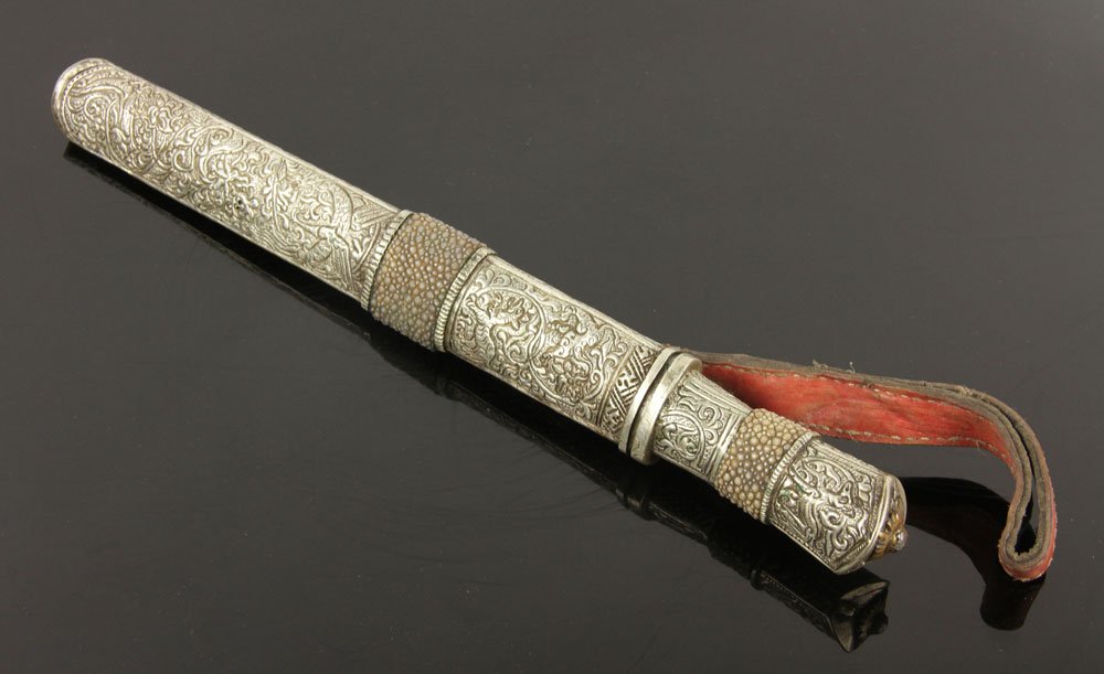 Tibetan Dagger: Tibetan dagger, from Kham province, silver hilt and scabbard with shagreen bands, embossed with animal designs; 9 1/2" l (blade), 13" l (overall). Provenance: From the unreserved Vincent J. Vabri Edge