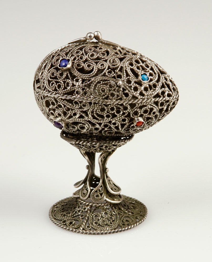 Judaica Silver Filigree Egg with Stand: Judaica filigree egg, with stand, silver, hallmarked, rare; 2 3/4" h x 2" w (egg), 4 3/8" h (total). Provenance: From a Connecticut estate.