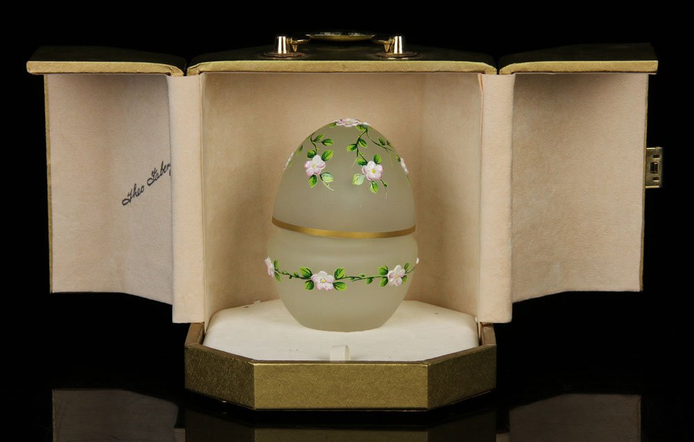 Theo Faberge, "The Spring Egg": Theo Faberge (English, 1922-1970), "The Spring Egg," frosted and enameled glass, gilt Easter egg inside with sterling silver crown, editioned 140/750, signed on base, original box, 5" h. Provenance: F