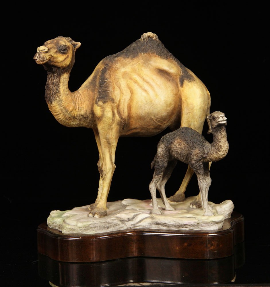 Boehm, "Arabian Camel and Calf," Porcelain: Boehm figural group, porcelain, "Arabian Camel and Calf," with wooden plinth, 13 1/4" h x 12 1/4" w x 7 1/4" d. Provenance: From a New Hampshire estate.