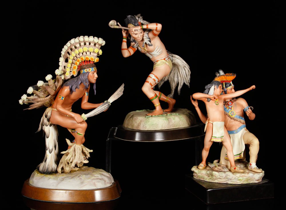 Cybis, Lot of 3 Figures: Lot of three Cybis Native American figures, porcelain, to include: warrior, dancer and man with boy; tallest 19 1/4" h. Provenance: From a New Hampshire estate.