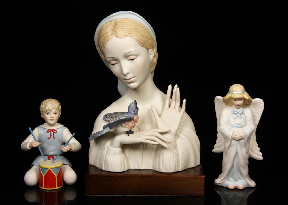 Cybis, Lot of 3 Figures: Lot of three Cybis figures, bisque, to include: bust of a woman holding bluebird, angel and drummer boy; tallest 11 1/2" h (with stand). Provenance: From a New Hampshire estate.
