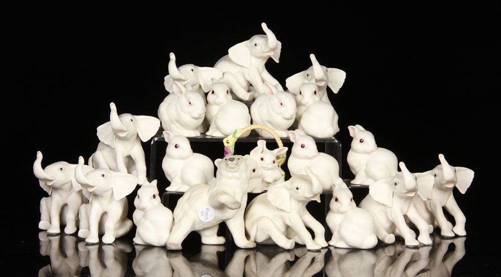 Lot of 20 Cybis Figures, Porcelain: Lot of twenty Cybis figures, porcelain, to include: nine elephants (5 1/2" h), nine bunnies (4 1/2" h), one basket with two bunnies (4" h) and one polar bear (6" h). Provenance: From a New Hampshire e