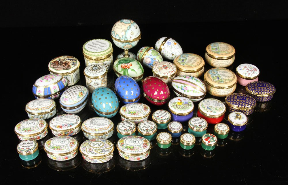 Lot of Boxes, Porcelain and Enamel: Large collection of boxes, porcelain and enamel on copper, to include: thirty-one "Halcyon Days" enamel on copper boxes, three Crummles boxes, and seven Limoges porcelain eggs. Provenance: From a New 