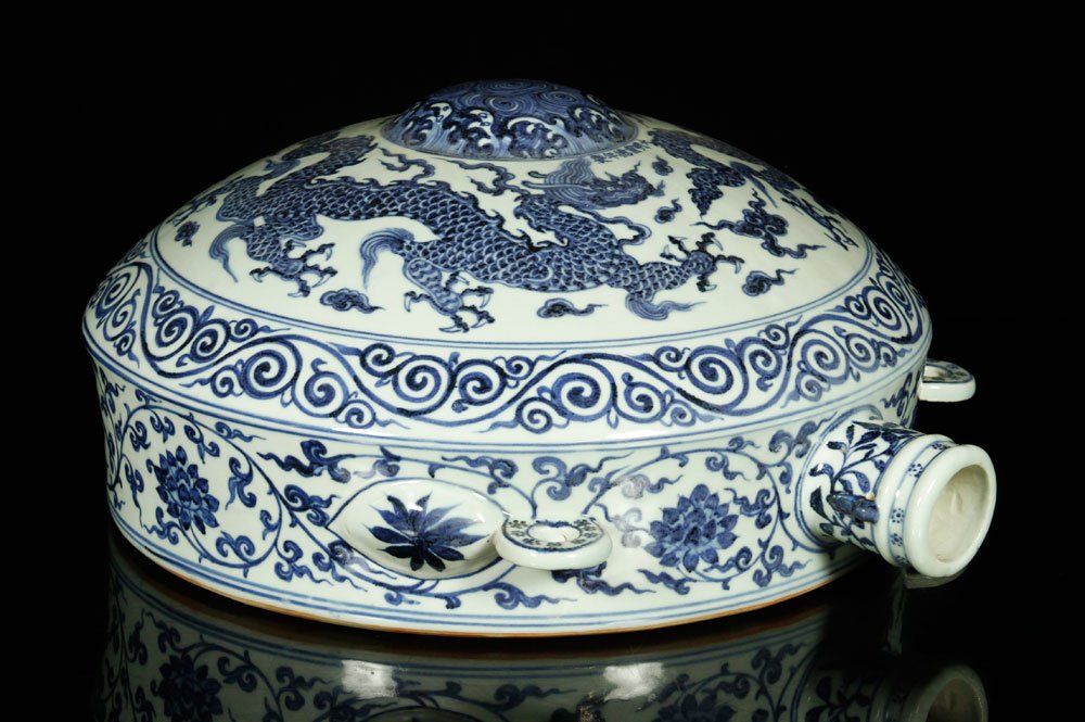 Chinese Ming Style Blue and White Vase: Blue and white porcelain vase, China, Ming Dynasty style, decorated with dragon design, with circular handles, 17" h.
