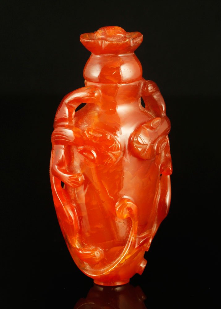 Chinese Carnelian Snuff Bottle: Carved carnelian snuff bottle, China, 3 3/4" h.