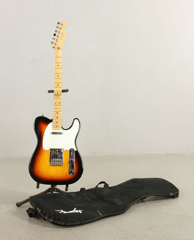 Fender Telecaster Guitar: Fender Telecaster guitar, circa 1980's, made in Mexico, serial number MN4128204, with gig bag. Provenance: From a Massachusetts estate.