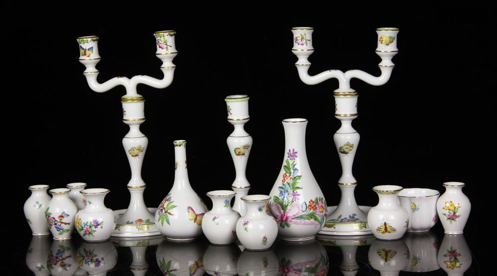 Lot of Herend Hungary Porcelain Pieces: Lot of various Herend Hungary pieces, porcelain painted with butterfly and flower design, to include: three candlesticks, one cup and ten small vases, 10 1/4" h (tallest). Provenance: from a Massachus