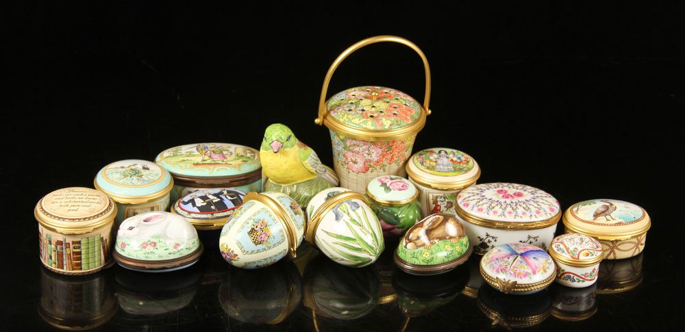 Lot of 16 Enamel Boxes: Collection of sixteen small boxes, enamel, to include fourteen by Halcyon Days of England and two by Limoges of France, decorated in various shapes and styles, all marked, 4" h (tallest). Provenance: 