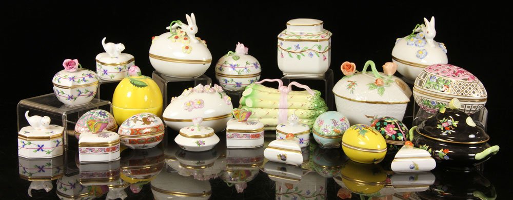 Lot of 24 Herend Hungary Boxes: Lot of twenty-four Herend Hungary boxes, hand-painted porcelain, in various forms including one in the form of a bunch of asparagus and several in the form of an egg, 4 3/4" h (tallest). Provenance: f