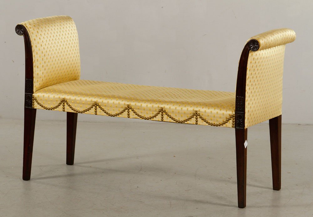 20th C. Hepplewhite Style Mahogany Window Bench: 20th century Hepplewhite style window bench, mahogany, having out-scrolled arms with molded stiles terminating in waterleaf-carved rosettes, similar carving at seat height, raised on square tapered le