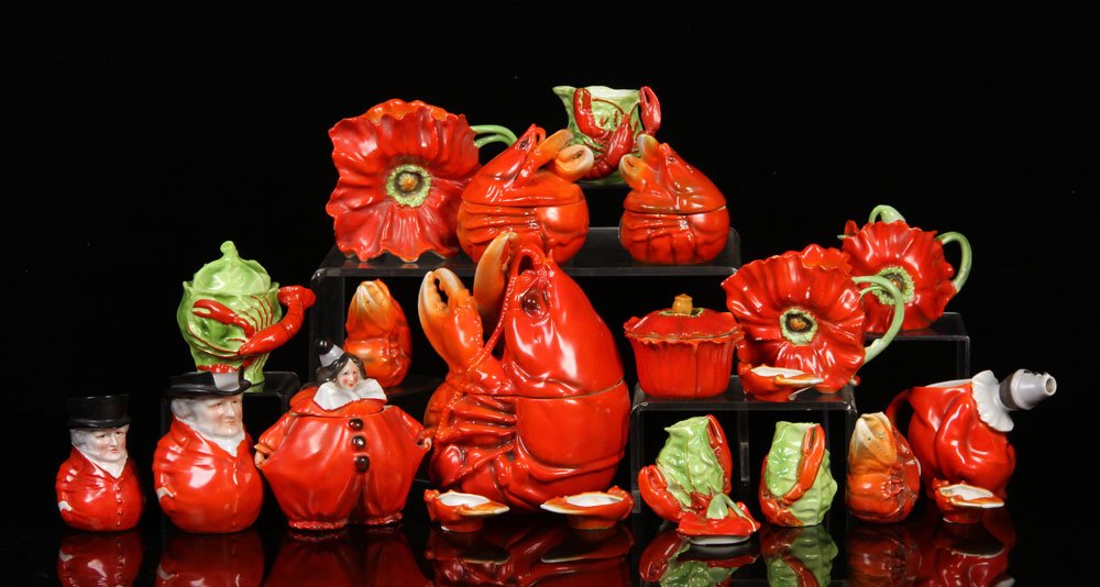 Collection of Royal Bayreuth Porcelain: Collection of Royal Bayreuth 'Lobster', 'Poppy', 'Clown' and 'Toby' porcelain, to include: cookie jar, sugar, creamers, salt and peppers, etc., 21 pieces total, not all pieces signed, tallest 8" h. Pr