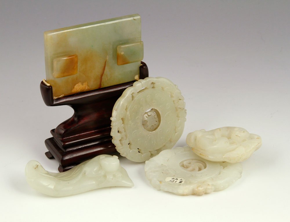 5 Chinese Jade Items: Lot of five Chinese jade items, to include one miniature screen with wood stand, and four pendants. Provenance: From the estate of Arthur R. Errion, M.D., of Salem, Massachusetts.