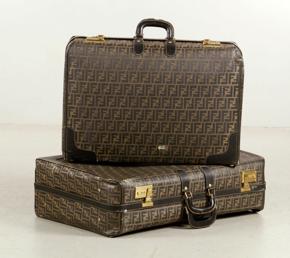 Two Fendi Suitcases: Lot of two Fendi suitcases, 20" h x 29" w and 17" h x 25" w. Provenance: Purchased at Fendi, Rodeo Drive, Beverly Hills.