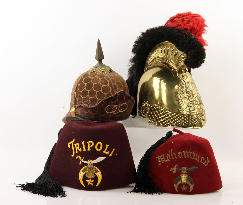 Pompiers de Strasbourg Helmet and 3 Hats: French pompiers de Strasbourg helmet, with three other hats, top brass banner reads "DEVOUEMENT." Provenance: From a California estate.