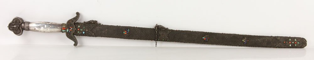 Mongolian Long Sword: Mongolian long sword, unmarked silver (or silver colored metal) with exhaustive filigree, accented with coral, lapis and turquoise colored cabochon, 41 3/4" l (overall), dented on reverse, could be pl