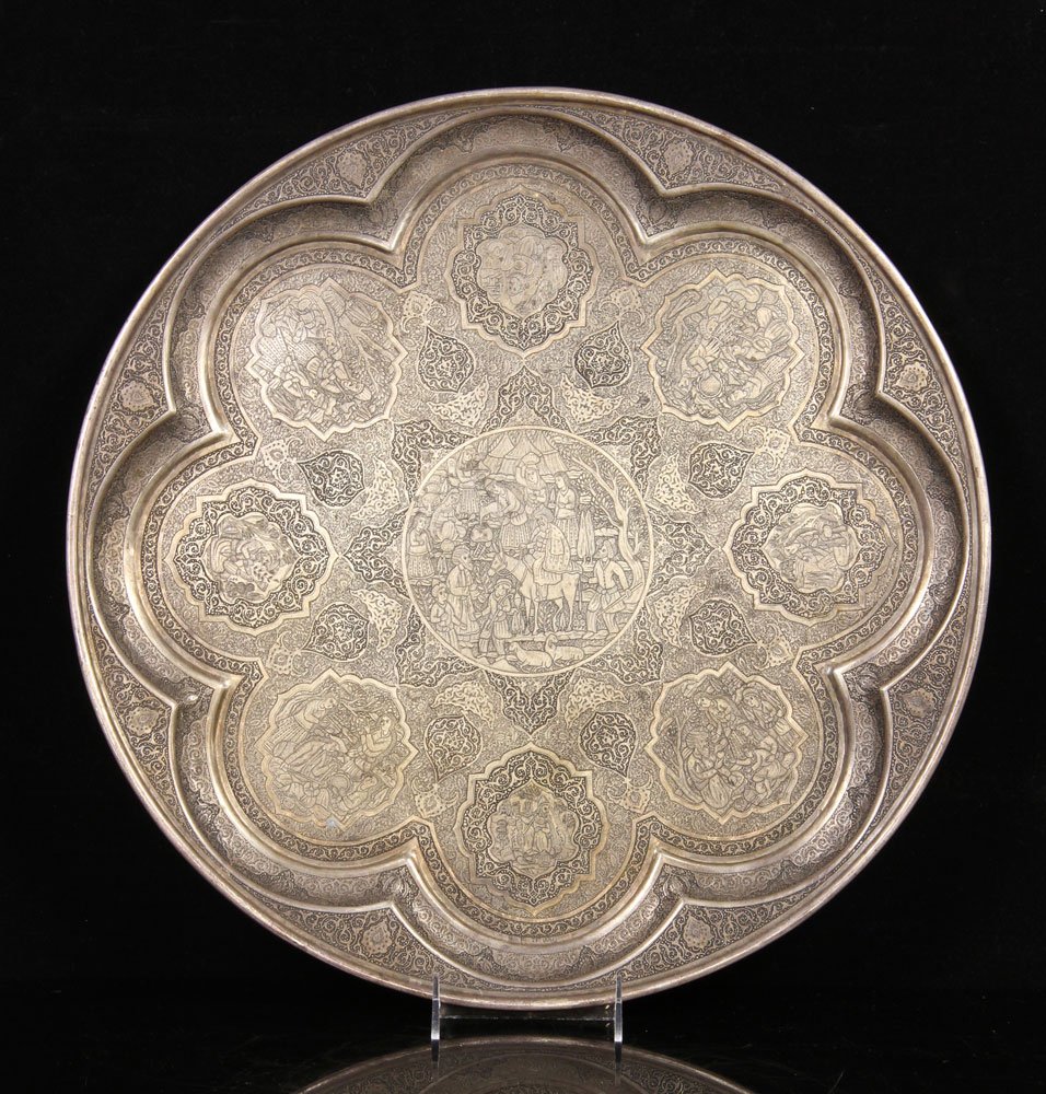Persian Silver Charger: Persian decorated charger, silver, hand engraved with scenes of music players, meditation and hookahs, signed on border, master engraver "Ostad." Provenance: from the private collection of a Newport B