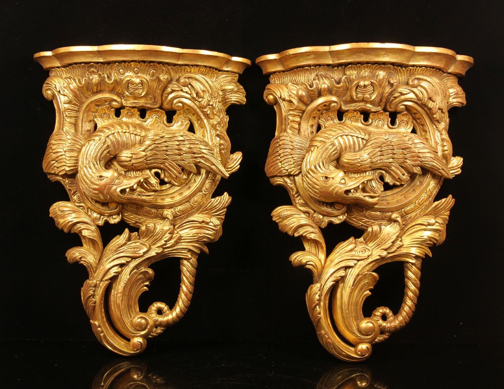 Pair of Rococo Wall Brackets: Pair of Rococo style wall brackets, carved giltwood with winged dragon decoration, 22" h x 15 1/2" w x 5 1/2" d. Provenance: from a New York estate.