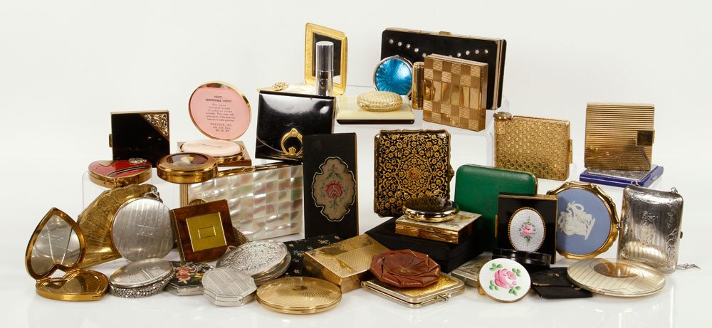 Large Collection of Compacts: Large collection of compacts, made of various materials, including: sterling silver, guilloche enamel, Wedgwood Jasperware, and more; in various motifs including Boy Scouts of America den mother, and