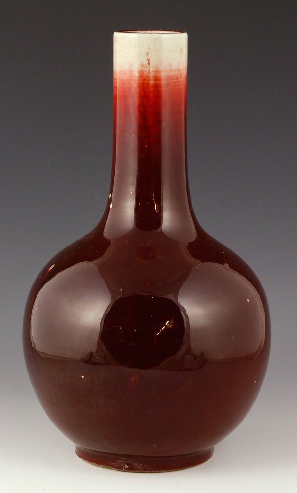 Chinese Oxblood Glazed Flask Vase: Chinese oxblood red glazed vase, porcelain, ball-shaped body, 14" h. Provenance: From a Massachusetts estate.