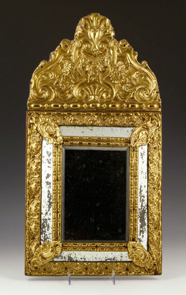 19th C. Brass Courting Mirror: European courting mirror, 19th century, brass clad, floral motif, wood back, 22" h x 12" w. Provenance: From a Massachusetts estate.