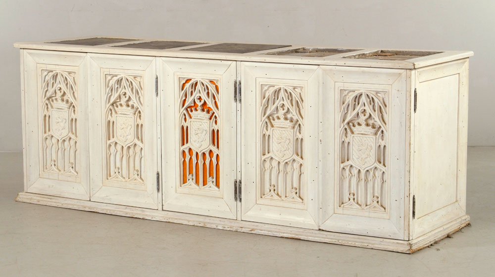 Gothic Carved Chest: Gothic carved chest, with slate inserts in top, four doors, and six interior drawers, 27 1/4" h x 73" l x 22" d. Provenance: From a California estate.