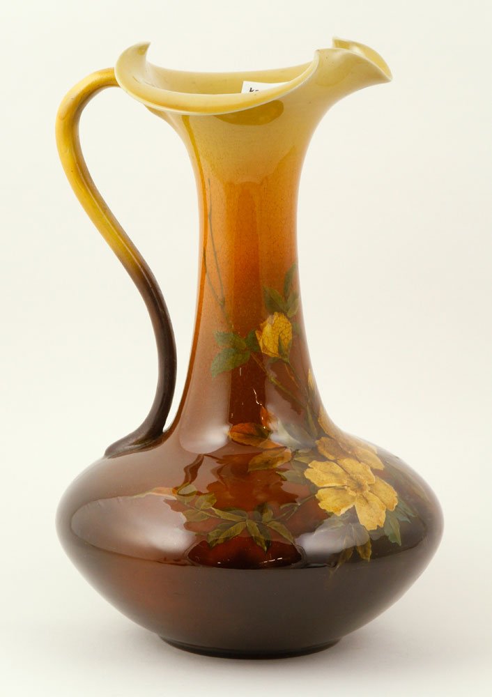 Rookwood Pottery Ewer: Rookwood pottery ewer, with floral motif, signed "MAD," numbered 469BS, 11" h x 7" w. Provenance: From the estate of the late Harry Reed Everson, an avid collector, from Marblehead, MA.
