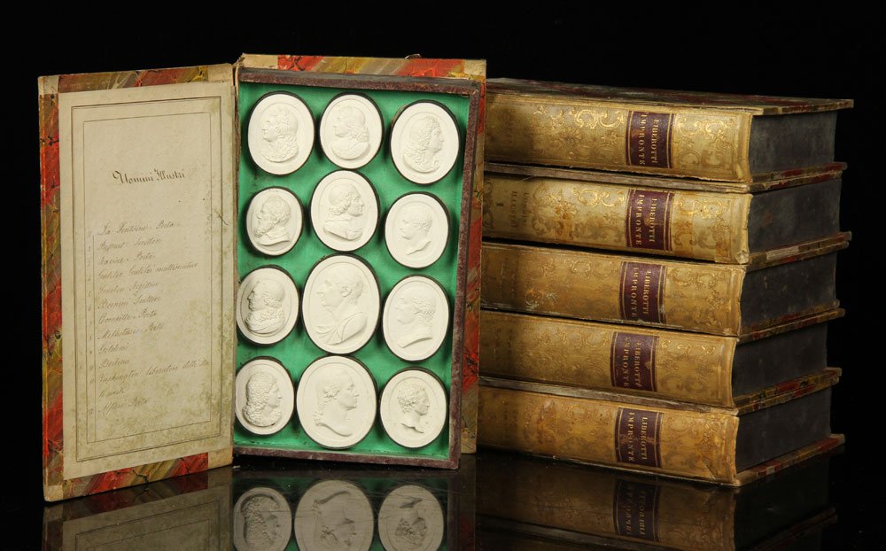 Large Lot of Liberotti Impronte Plaster Plaques: Large lot of plaster plaques, two hundred and thirty-six total, in six double-sided cases, marked "Liberotti Impronte," showing famous personages, buildings and others; largest approximately 2 1/2" h