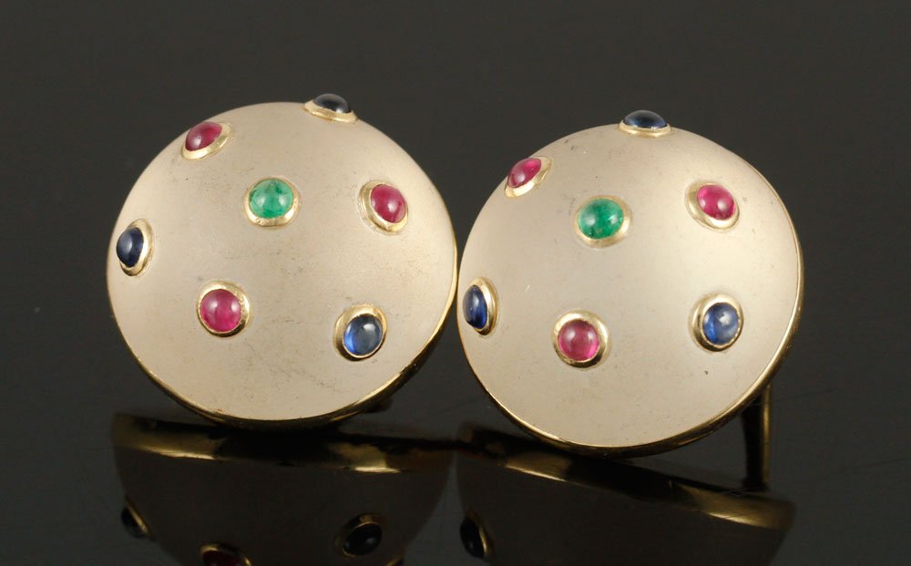 Pr. 14K Yellow Gold Trianon Earrings: Pair of 14K gold clip earrings, with emeralds, sapphires and rubies set in moonstone, signed "Trianon," 3/4" h, approximately 17 grams TW. Provenance: From a Massachusetts collection.