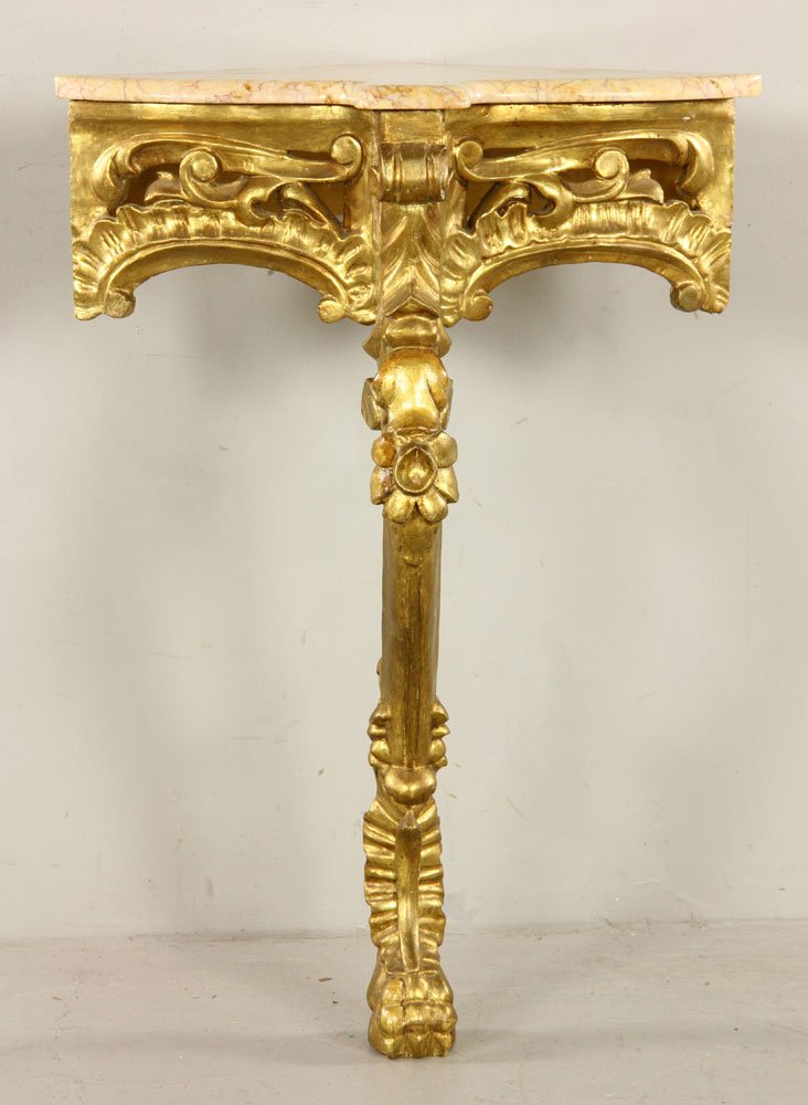 Italian Corner Stand: Italian corner stand, early 20th century, with marble top and 23K gold leaf accents, single leg with lion's-paw foot. Provenance: From a Massachusetts estate.