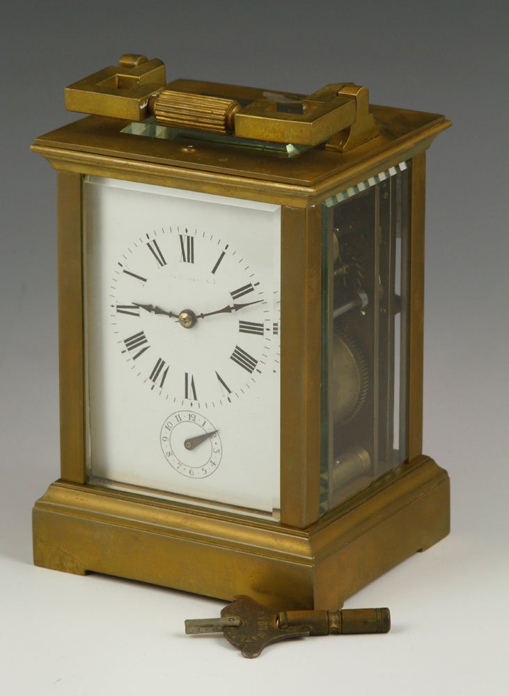 20th C. French Carriage Clock: French carriage clock, early 20th century, signed, key included, 7 1/4" h (with handle). Provenance: From a Massachusetts estate.