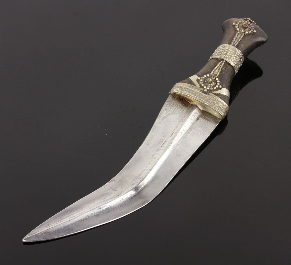 Horn Hilt Jambiya: Jambiya, silver-studded horn hilt, large fuller in center of blade, no scabbard or sheath; 8" l (blade), 12" l (overall). Provenance: From the unreserved Vincent J. Vabri Edged Weapon Collection.