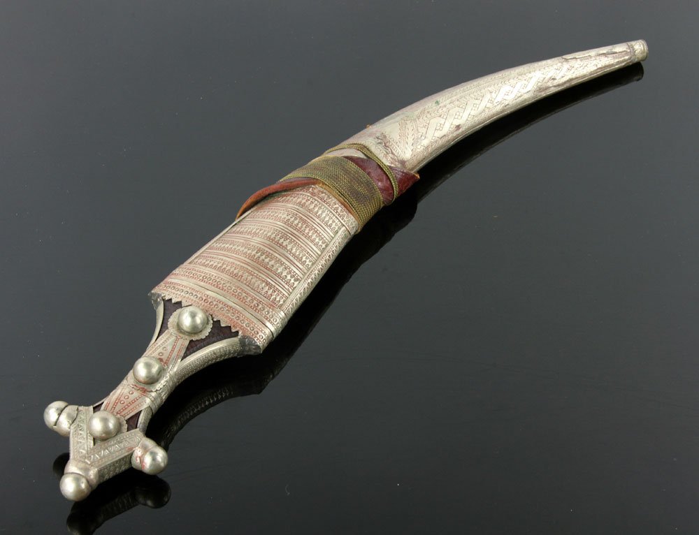 Wahabite Arabian Jambiya: Large Wahabite Arabian jambiya, wooden grip, silver fittings, silver and brass scabbard; 14" l (blade), 19 1/2" l (overall). Provenance: From the unreserved Vincent J. Vabri Edged Weapon Collection.