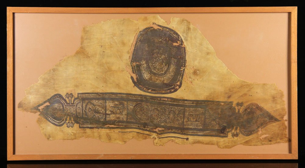 4th to 5th C. Coptic Textile Fragment: Coptic textile fragment, 4th to 5th century, framed under glass; 37" l x 18" w (textile), 39 1/2" l x 21" w (frame); Coptic cloth is a fine, dense fabric produced in the 2nd - 8th centuries AD, by the