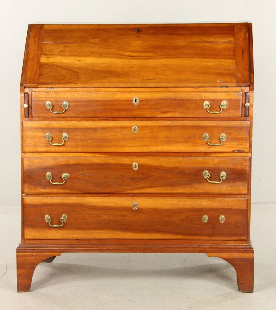 Cherry Drop Front Desk: New England slant top desk, cherry wood, 19th century, with four drawers, pigeon hole interior, hand-planed and grooved boards, 38" h x 45" w. Provenance: From a Massachusetts estate.