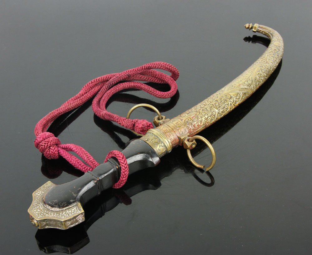Moroccan Jambiya: Moroccan Jambiya, brass and silver hilt and scabbard, owner's name engraved on scabbard; 9" l (blade), 15" l (overall). Provenance: From the unreserved Vincent J. Vabri Edged Weapon Collection.