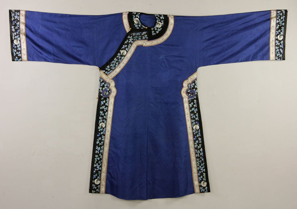Chinese Women's Robe: Chinese women's robe, Han Fu, gilt bronze buttons, decorated with concealed coiled dragons, coiled phoenixes, blue and black border, 52" l. Provenance: from an East Coast private collection.