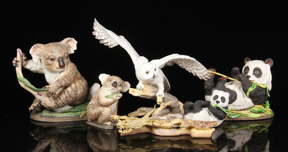 6 Boehm Figures: Lot of six Boehm porcelain figures, to include: snowy owl, koala, baby koala, reclining giant panda and cub, and horned lizard, tallest 11" h. Provenance: From a California estate.