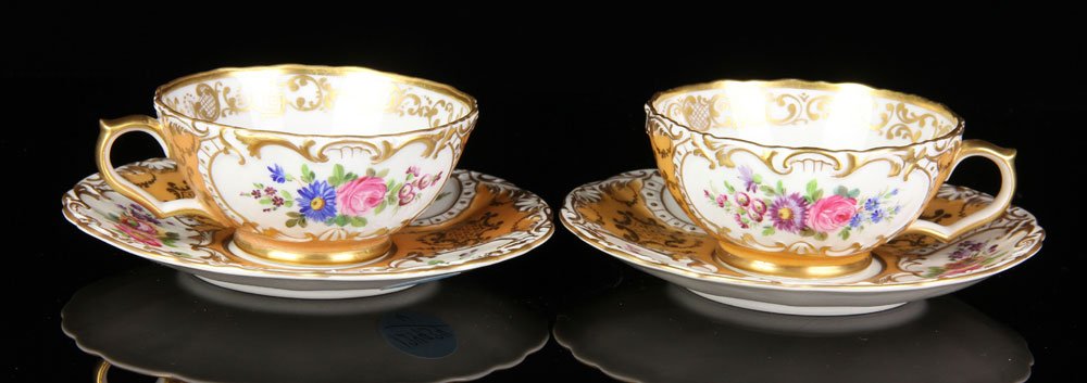 Pr. 19th C. Jacob Petit Cups and Saucers: Pair of 19th century Jacob Petit cups and saucers, cups 2" h x 4" w, saucer 6" dia. Provenance: From a California estate.