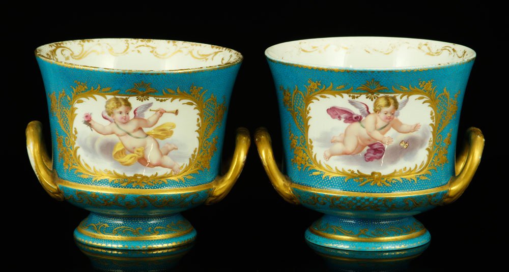 Pr. Sevres Cache Pots: Pairs of Sevres cache pots, in blue celeste glaze, with floral and putti decoration, 4 3/4" h x 5 1/8" dia. Provenance: From the unreserved private collection of Dorothea M. Beers, Palm Beach, Florida