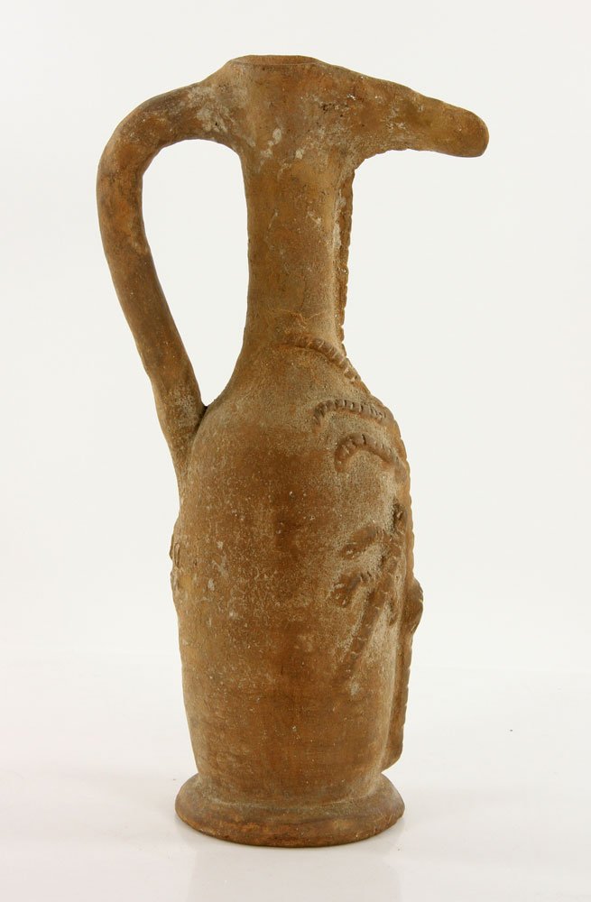 Pre-Colombian Water Vessel: Pre-Colombian water vessel, terra cotta, decorated with human, tree and lizard figures, museum archive number on base, 15 1/2" h.
