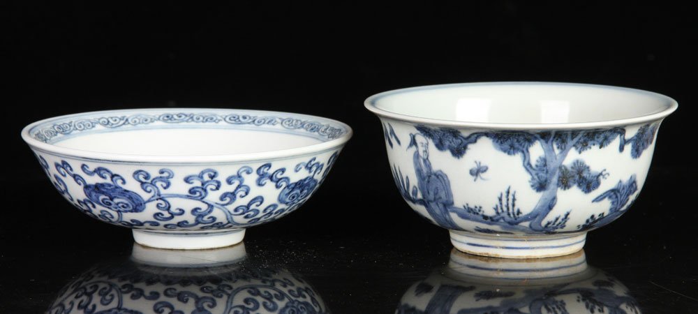 Two Chinese Blue and White Bowls: Lot of two Chinese blue and white bowls, porcelain, to include: one with Ming Wanli mark, 5 1/2" dia, the other decorated with floral pattern, 6" dia. Provenance: From a Massachusetts collection.