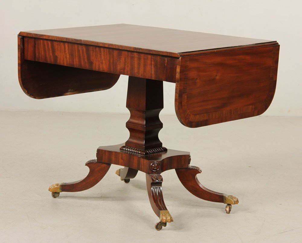 Regency-Style Sofa Table: Regency-style drop leaf sofa table, mahogany and rosewood, circa 1940, 29" h x 35" w x 25" d. Provenance: from a New York collection.