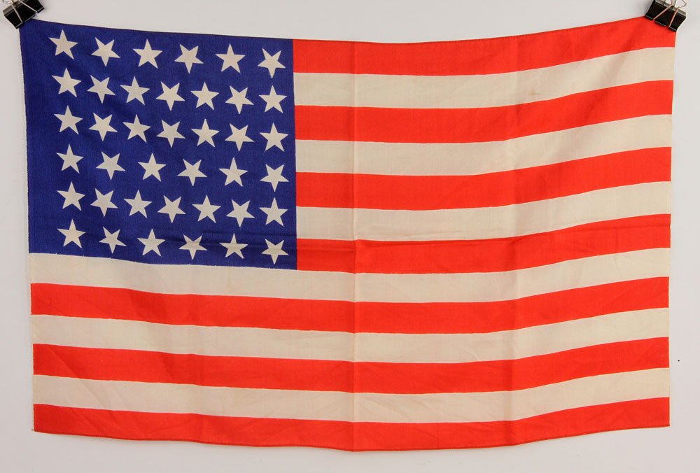 1889 39 Star American Flag: 1889 American flag, having 39 stars, made upon the statehood of Montana, North Dakota, South Dakota and Washington, silk, 15" x 24". Provenance: from a Massachusetts estate.