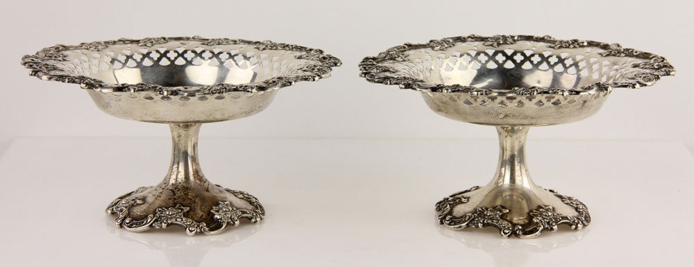 Pr. 19th C. Sterling Compotes: Pair of 19th century pierced compotes, sterling silver, having reticulation and ornate floral border, made by Theodore Starr, NY, 4 1/2" h x 6" dia, approximately 13.2 troy oz total weight. Provenance